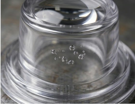 Bubbles trapped inside a clear plastic wall